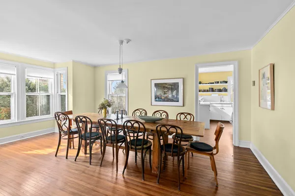 a view of a dining room with furniture and wooden floor