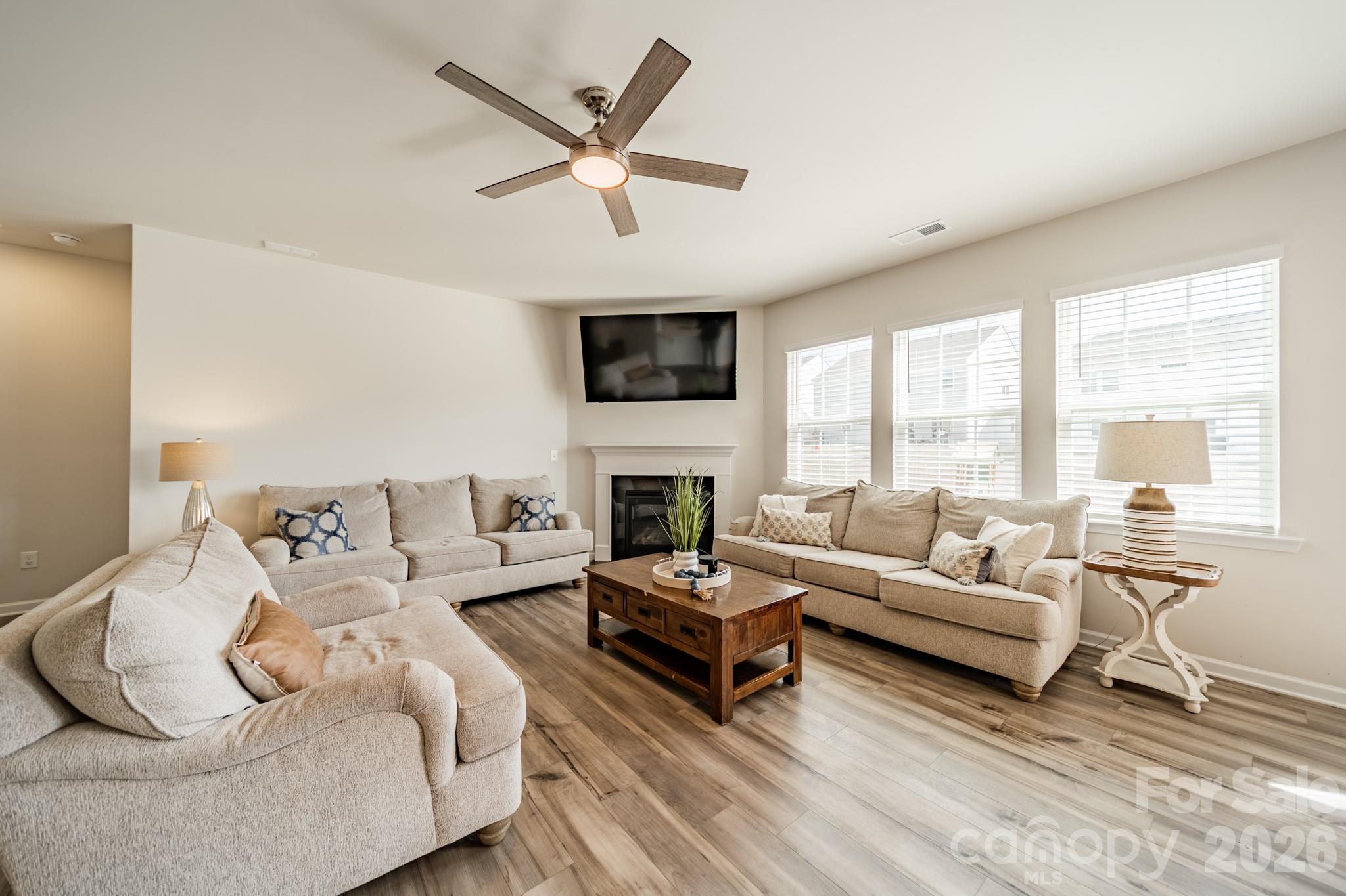 5542 Soft Shell Drive Lancaster, SC 29720 - Photo 12 of 43 a living room with furniture fireplace and a large window