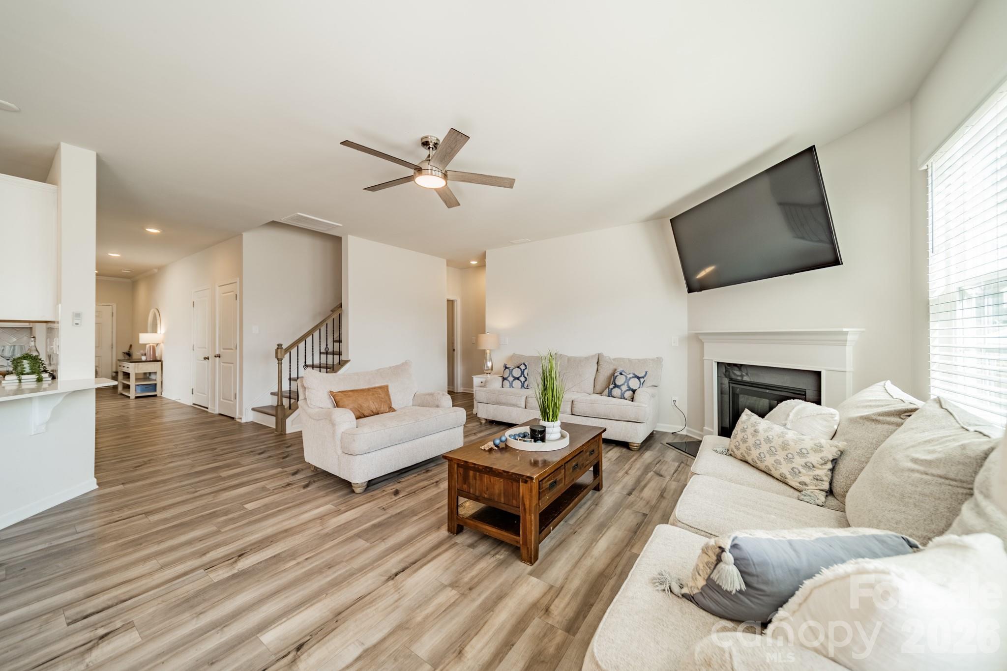 5542 Soft Shell Drive Lancaster, SC 29720 - Photo 14 of 43 a living room with furniture fireplace and a flat screen tv
