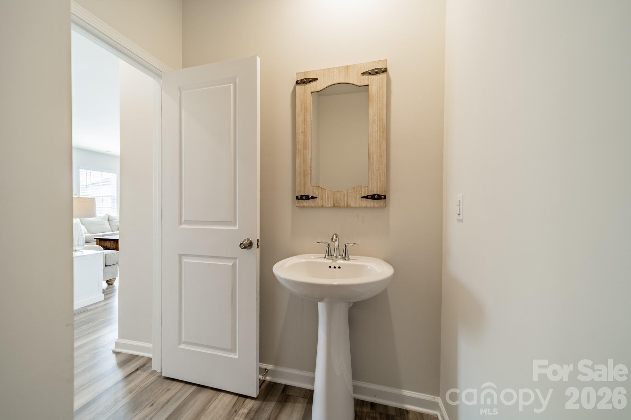 5542 Soft Shell Drive Lancaster, SC 29720 - Photo 18 of 43 a bathroom with a sink a mirror and shower