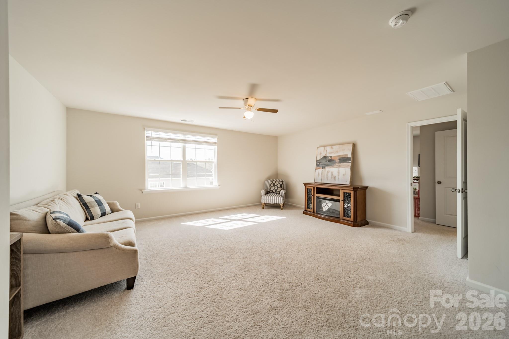5542 Soft Shell Drive Lancaster, SC 29720 - Photo 19 of 43 a living room with furniture and a flat screen tv
