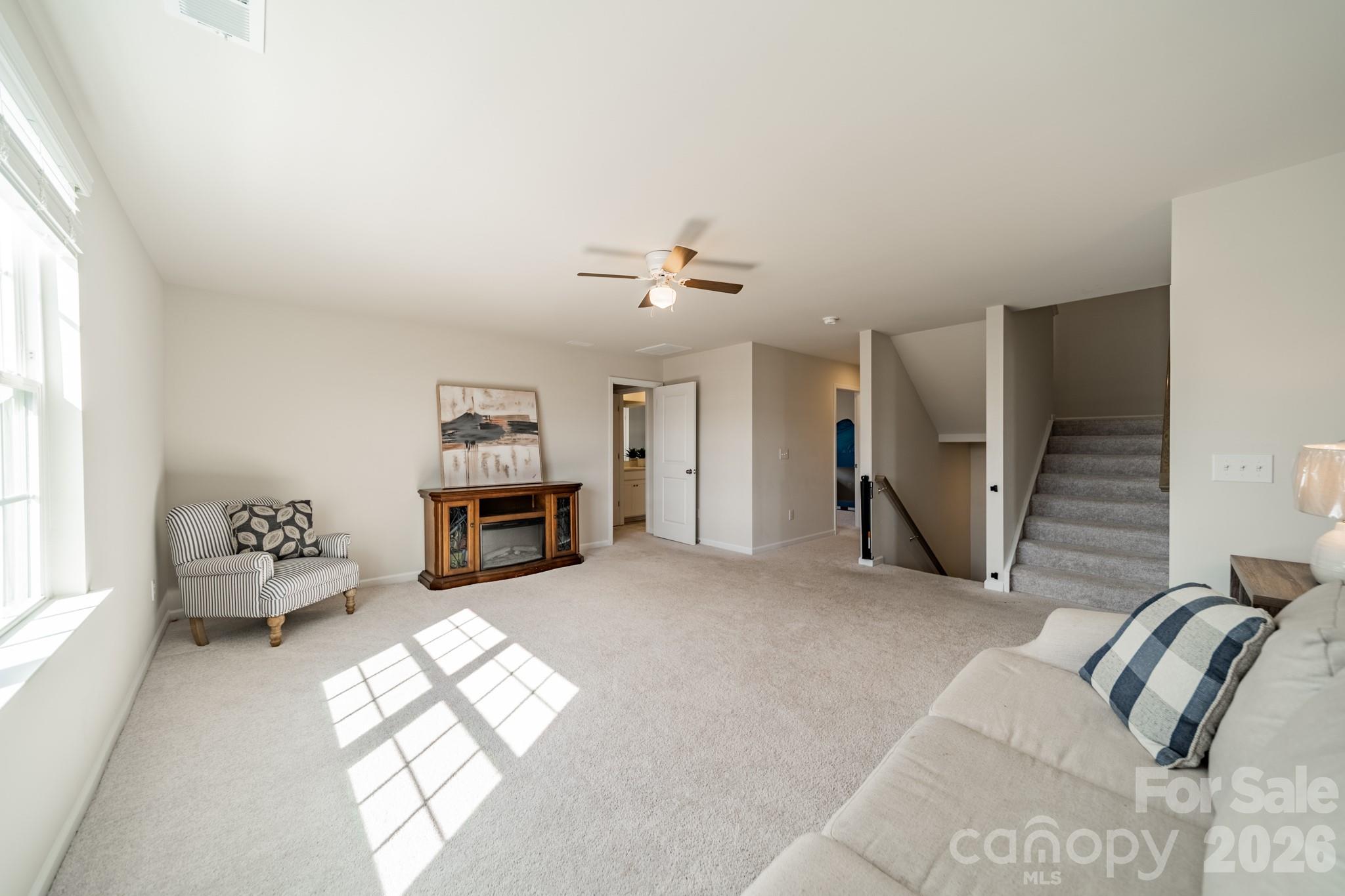 5542 Soft Shell Drive Lancaster, SC 29720 - Photo 20 of 43 a living room with furniture two window and a fireplace