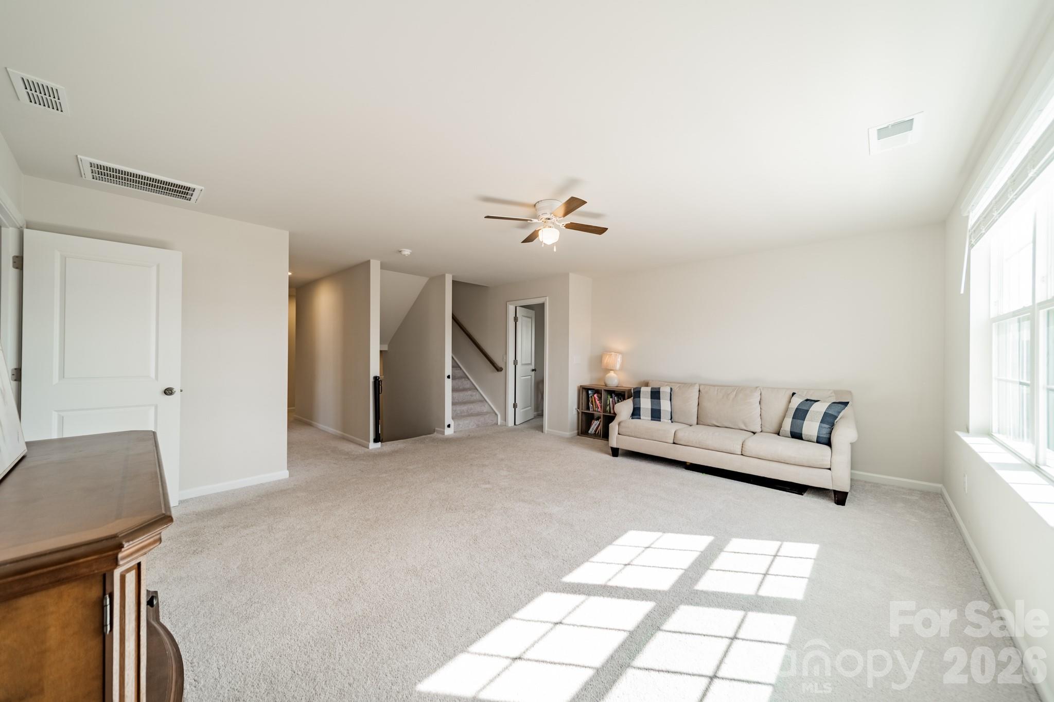 5542 Soft Shell Drive Lancaster, SC 29720 - Photo 21 of 43 a living room with furniture and a large window