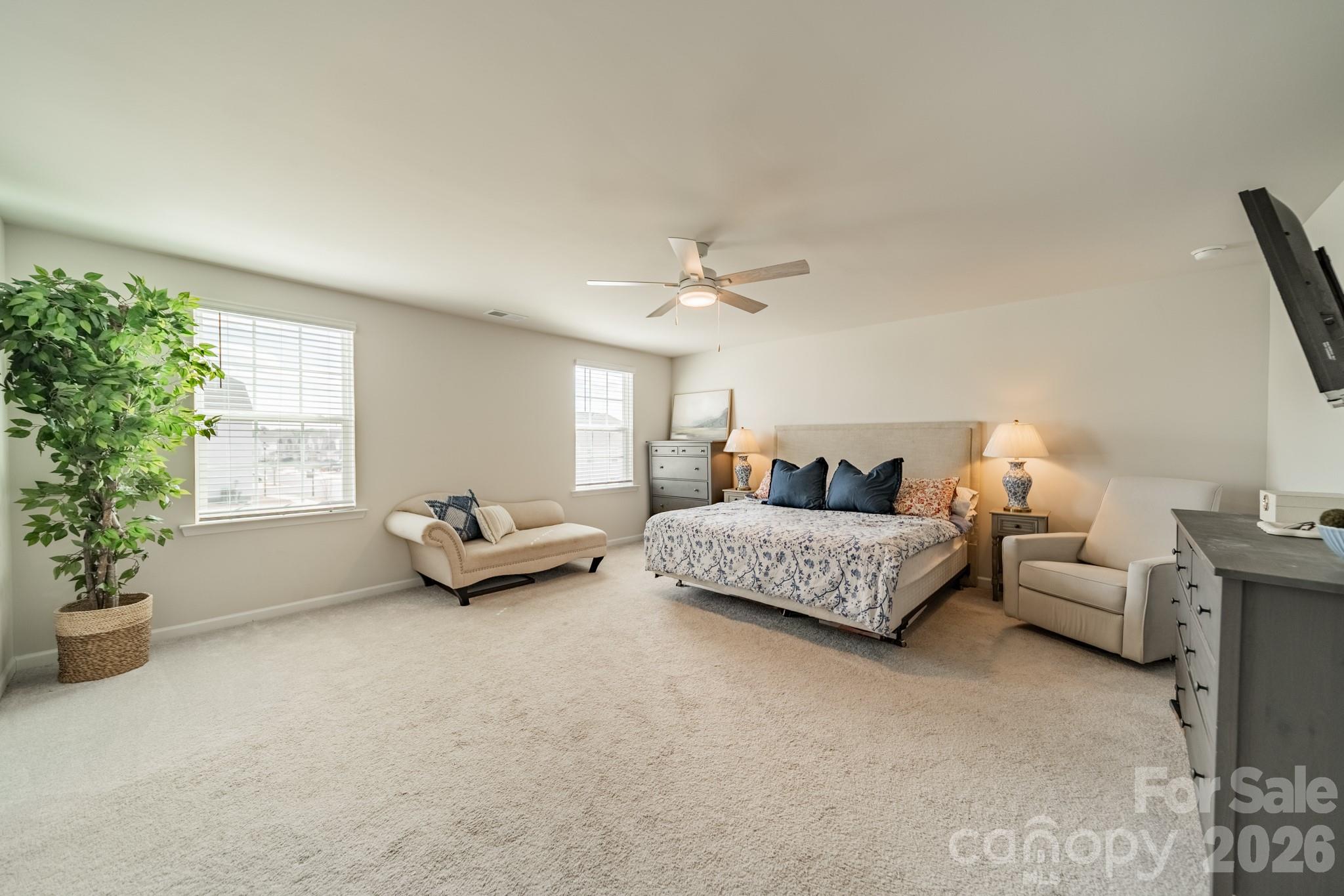 5542 Soft Shell Drive Lancaster, SC 29720 - Photo 22 of 43 a spacious bedroom with a bed and a couch