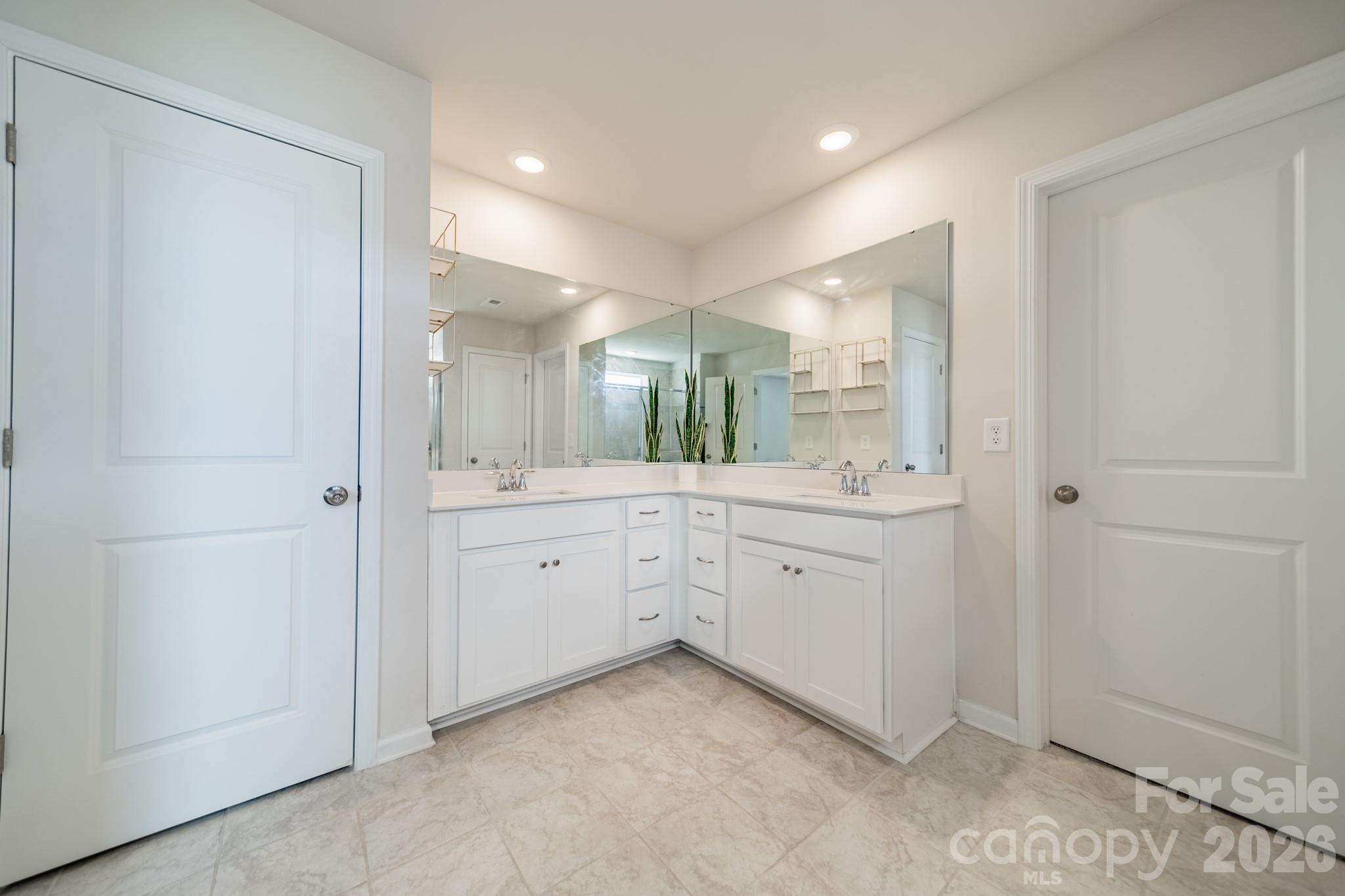 5542 Soft Shell Drive Lancaster, SC 29720 - Photo 24 of 43 a spacious bathroom with a granite countertop sink mirror and