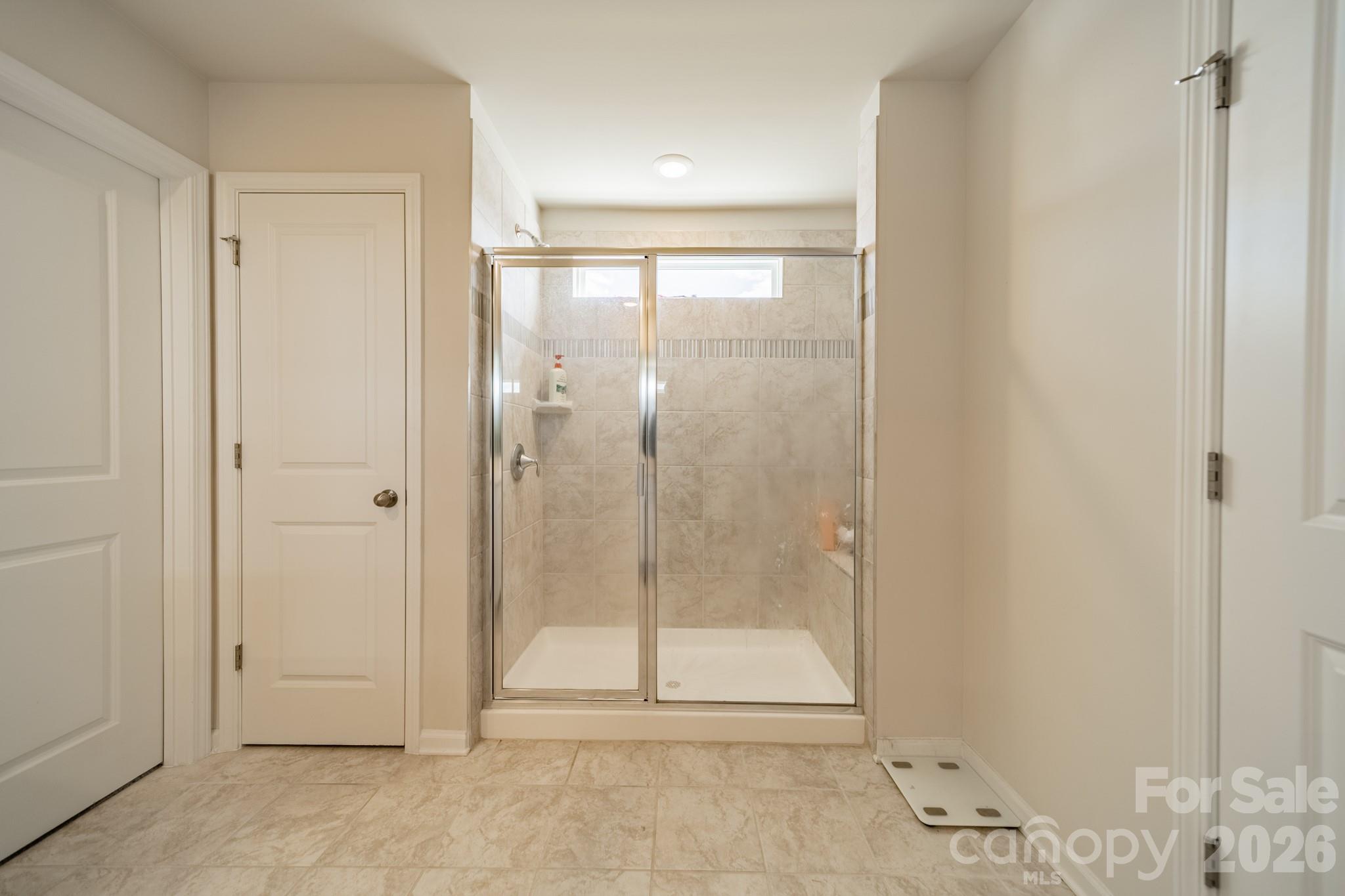 5542 Soft Shell Drive Lancaster, SC 29720 - Photo 25 of 43 a bathroom with a glass shower door
