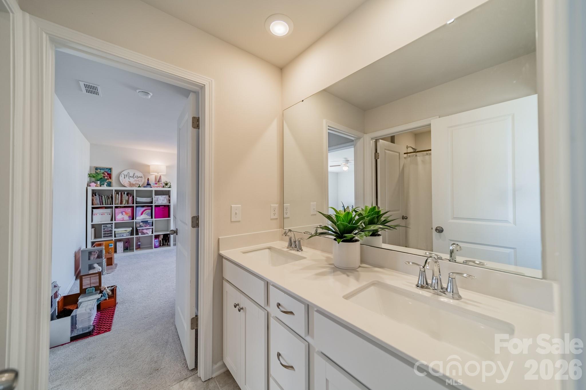 5542 Soft Shell Drive Lancaster, SC 29720 - Photo 27 of 43 a bathroom with a sink double vanity and shower