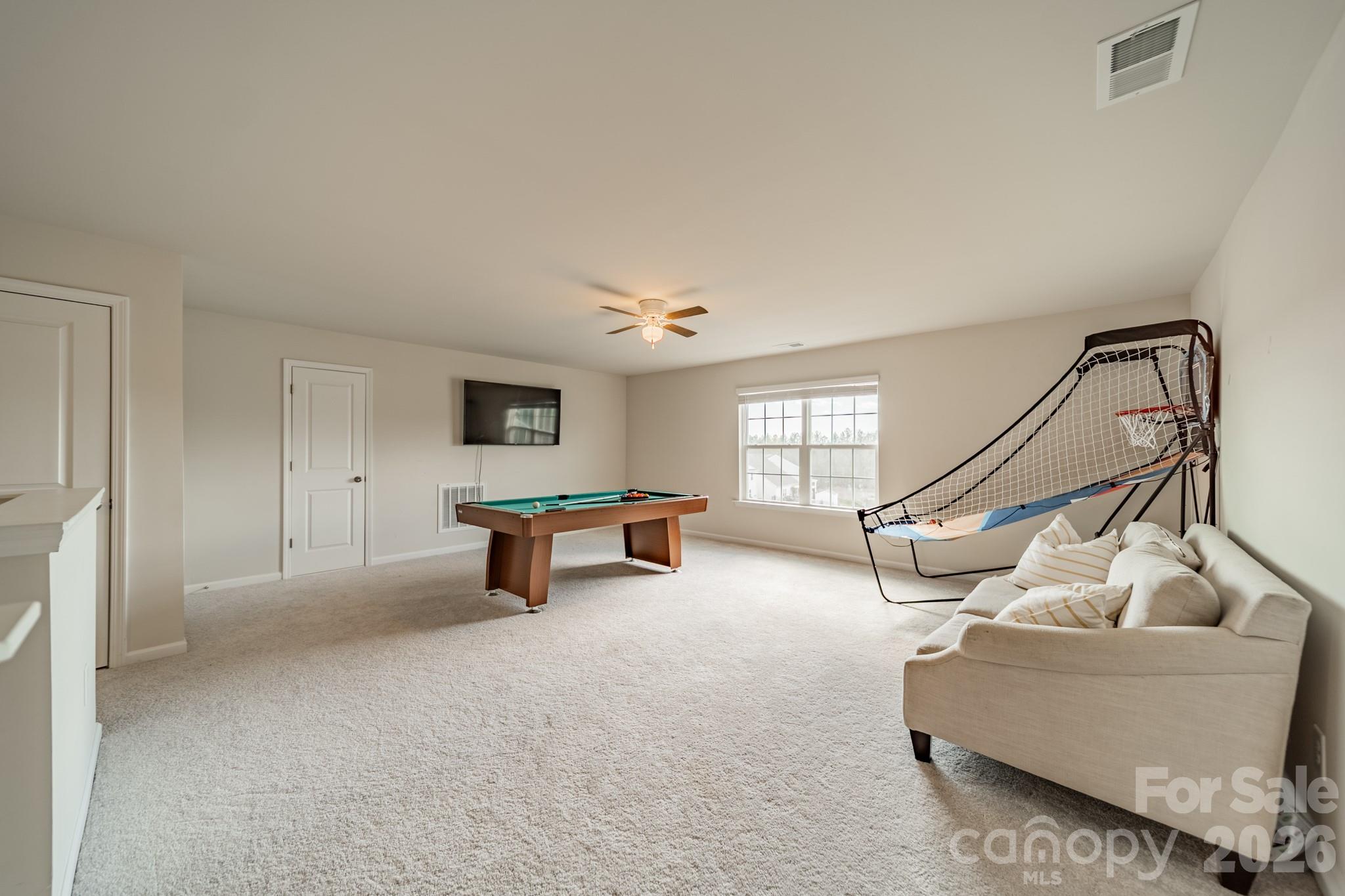 5542 Soft Shell Drive Lancaster, SC 29720 - Photo 32 of 43 a living room with furniture and a flat screen tv