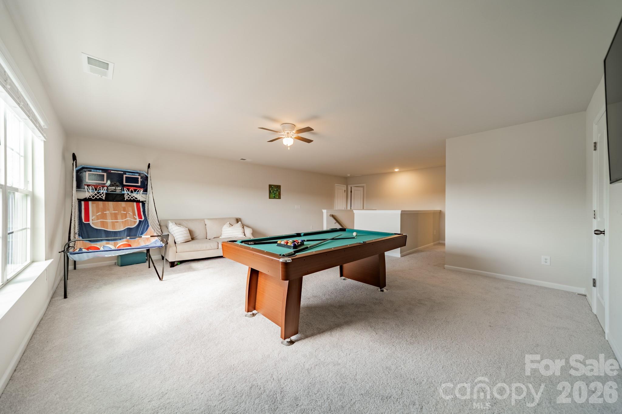 5542 Soft Shell Drive Lancaster, SC 29720 - Photo 33 of 43 a living room with furniture and a flat screen tv