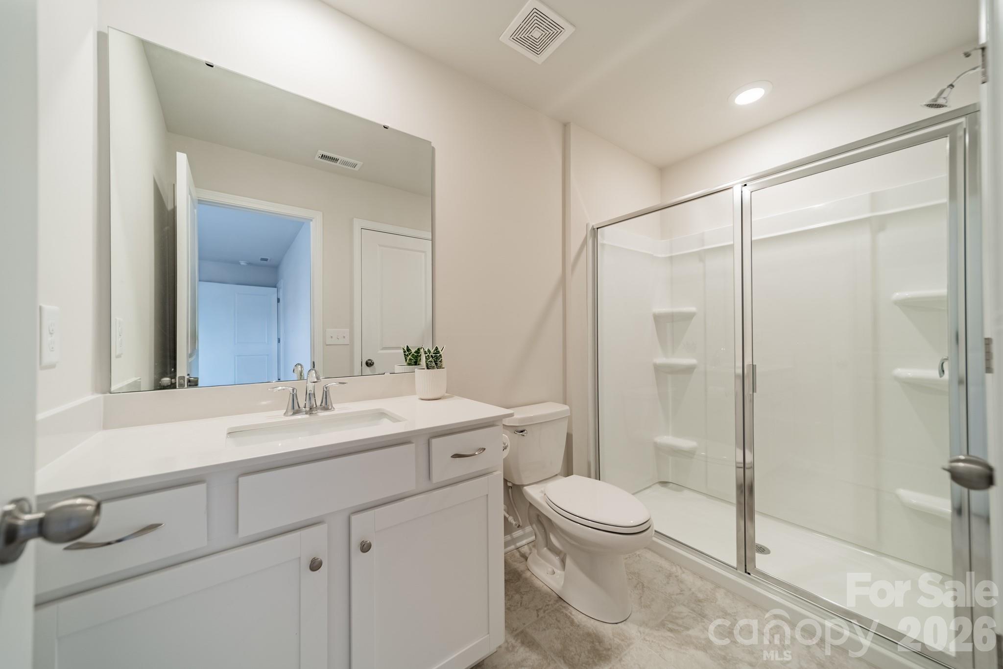 5542 Soft Shell Drive Lancaster, SC 29720 - Photo 35 of 43 a bathroom with a sink a toilet and shower