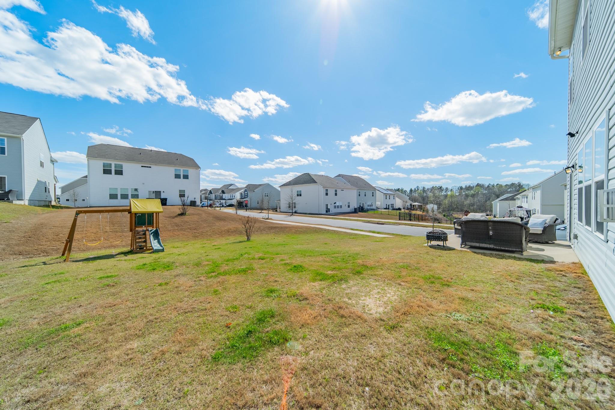 5542 Soft Shell Drive Lancaster, SC 29720 - Photo 39 of 43 a swimming pool with an outdoor seating and a yard