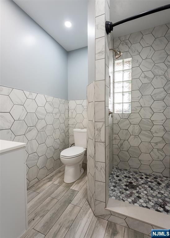 86 Hunter Street Lodi, NJ 07644 - Photo 11 of 18 a bathroom with a toilet and a shower