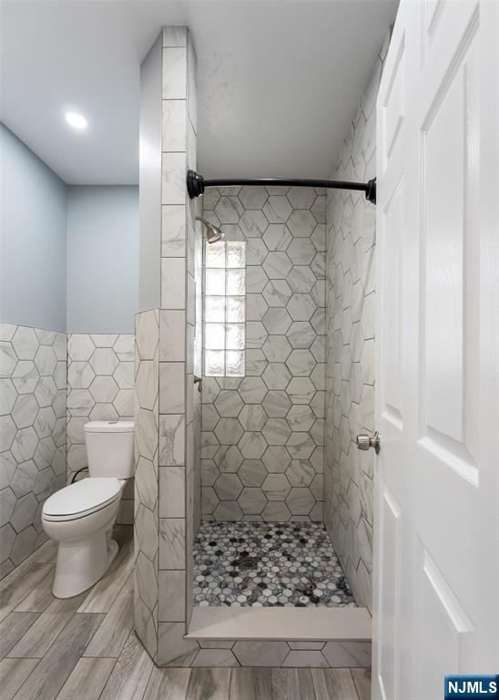 86 Hunter Street Lodi, NJ 07644 - Photo 10 of 18 a bathroom with a toilet and a shower