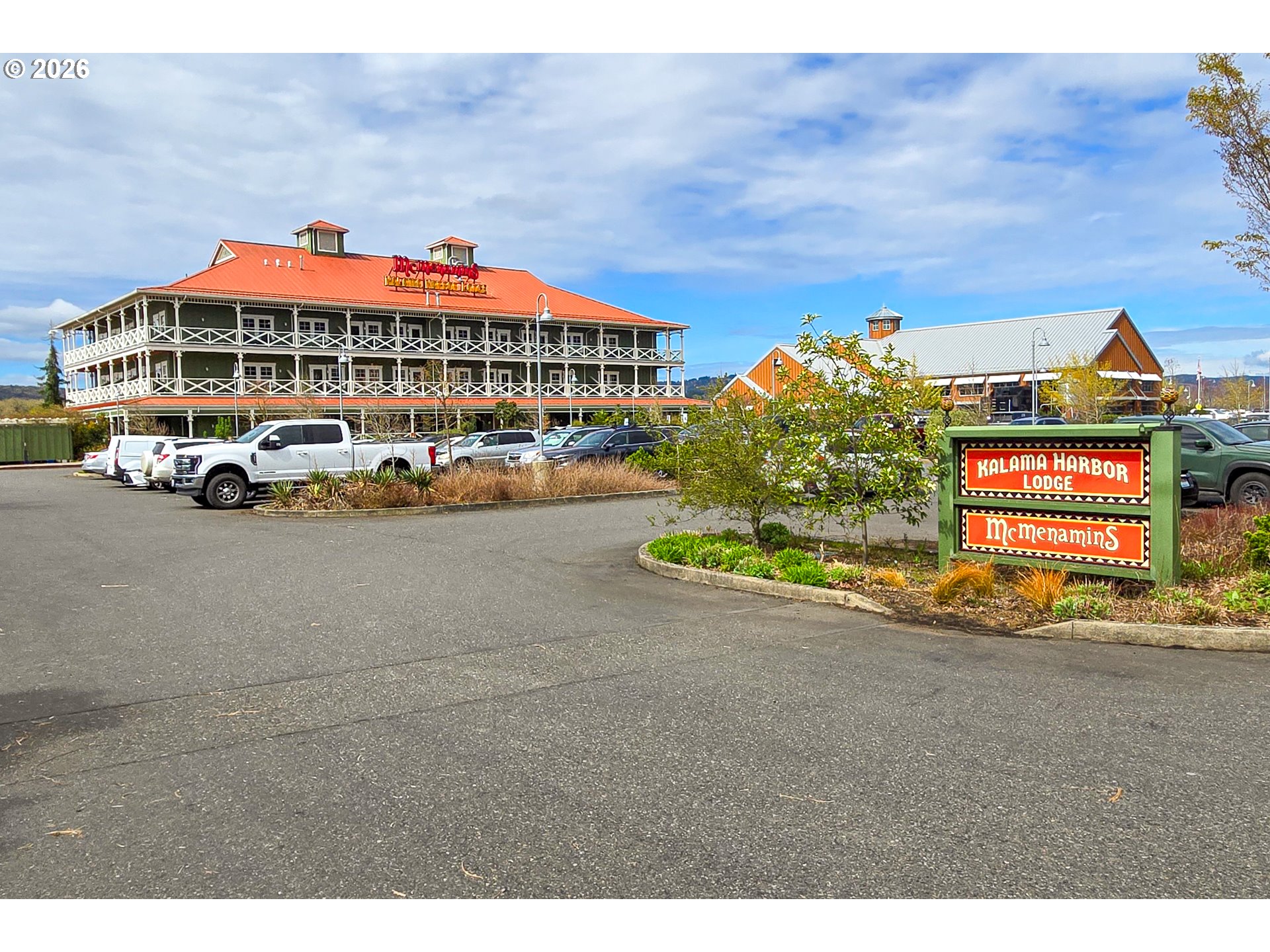 Spencer Creek Road Kalama, WA 98625 - Photo 20 of 21 a blue sign that is sitting in front of a building
