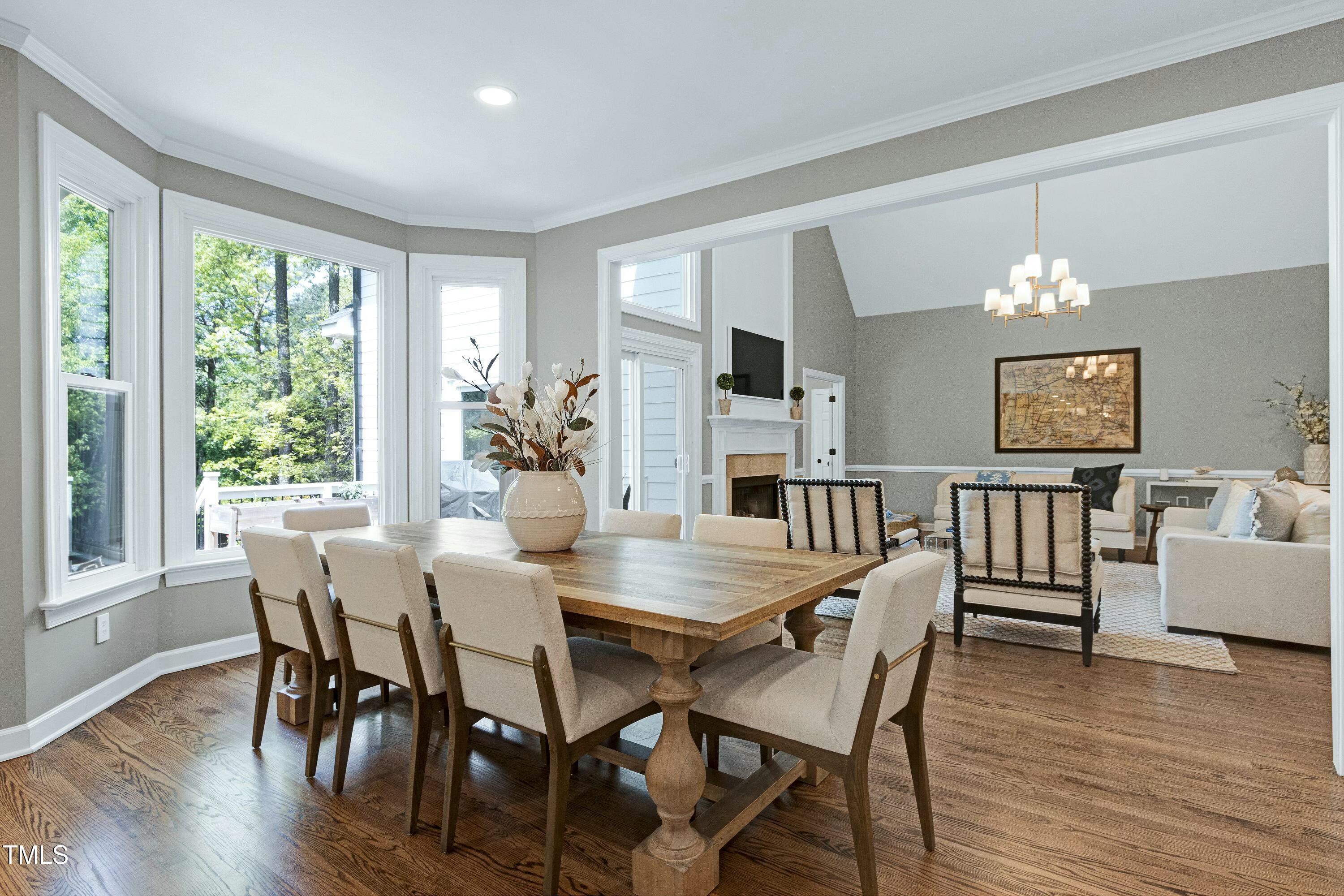 111 Finnway Lane Cary, NC 27519 - Photo 13 of 68 a view of a dining room with furniture window and wooden floor