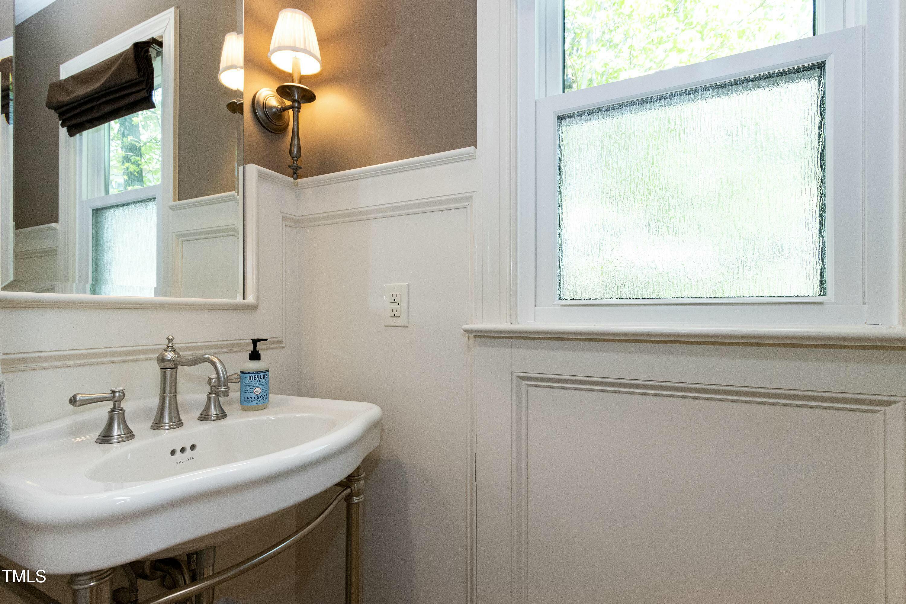 111 Finnway Lane Cary, NC 27519 - Photo 25 of 68 a bathroom with a sink and a mirror