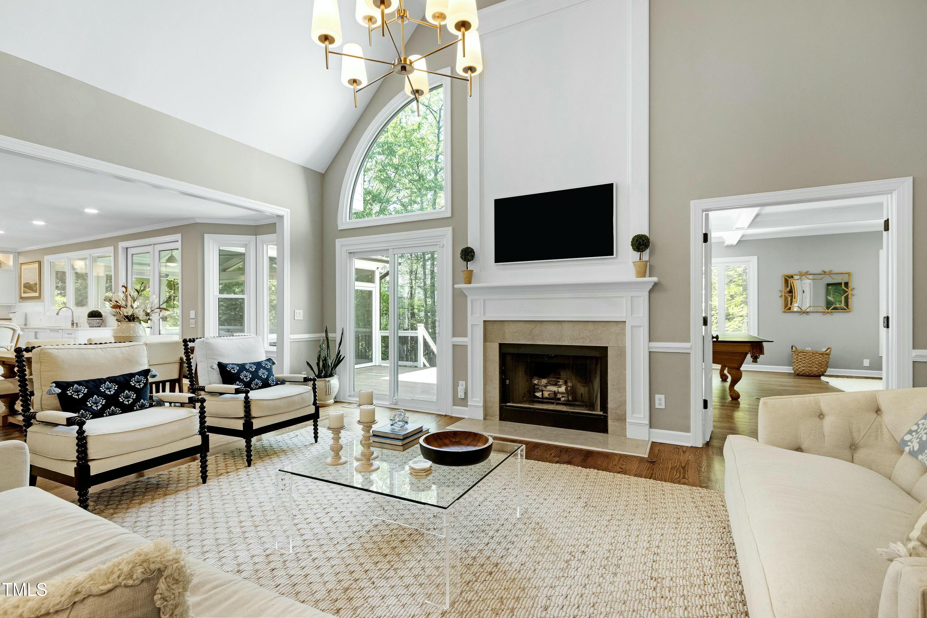 111 Finnway Lane Cary, NC 27519 - Photo 3 of 68 a living room with furniture fireplace and a flat screen tv