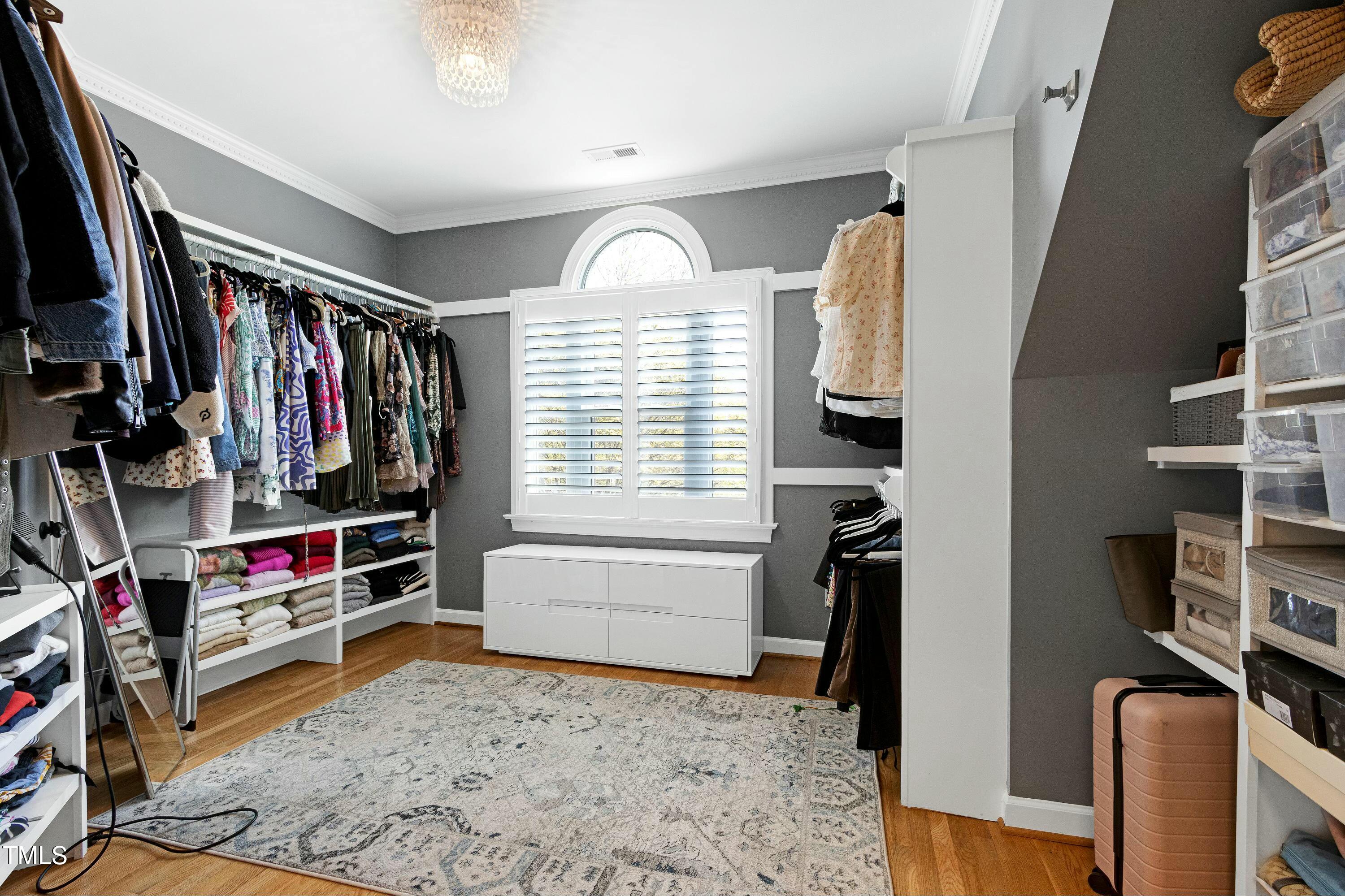 111 Finnway Lane Cary, NC 27519 - Photo 34 of 68 a view of walk in closet with clothes and shoes