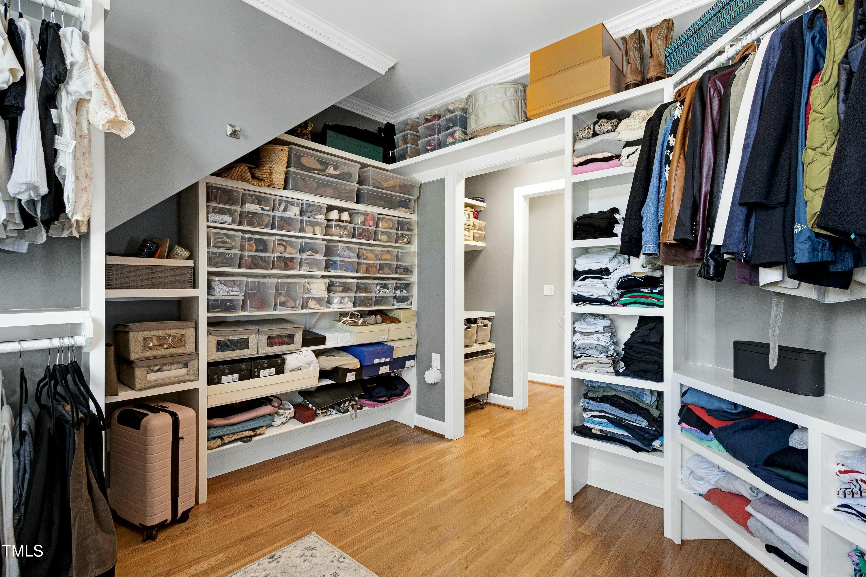 111 Finnway Lane Cary, NC 27519 - Photo 35 of 68 a view of walk in closet with clothes and shoes