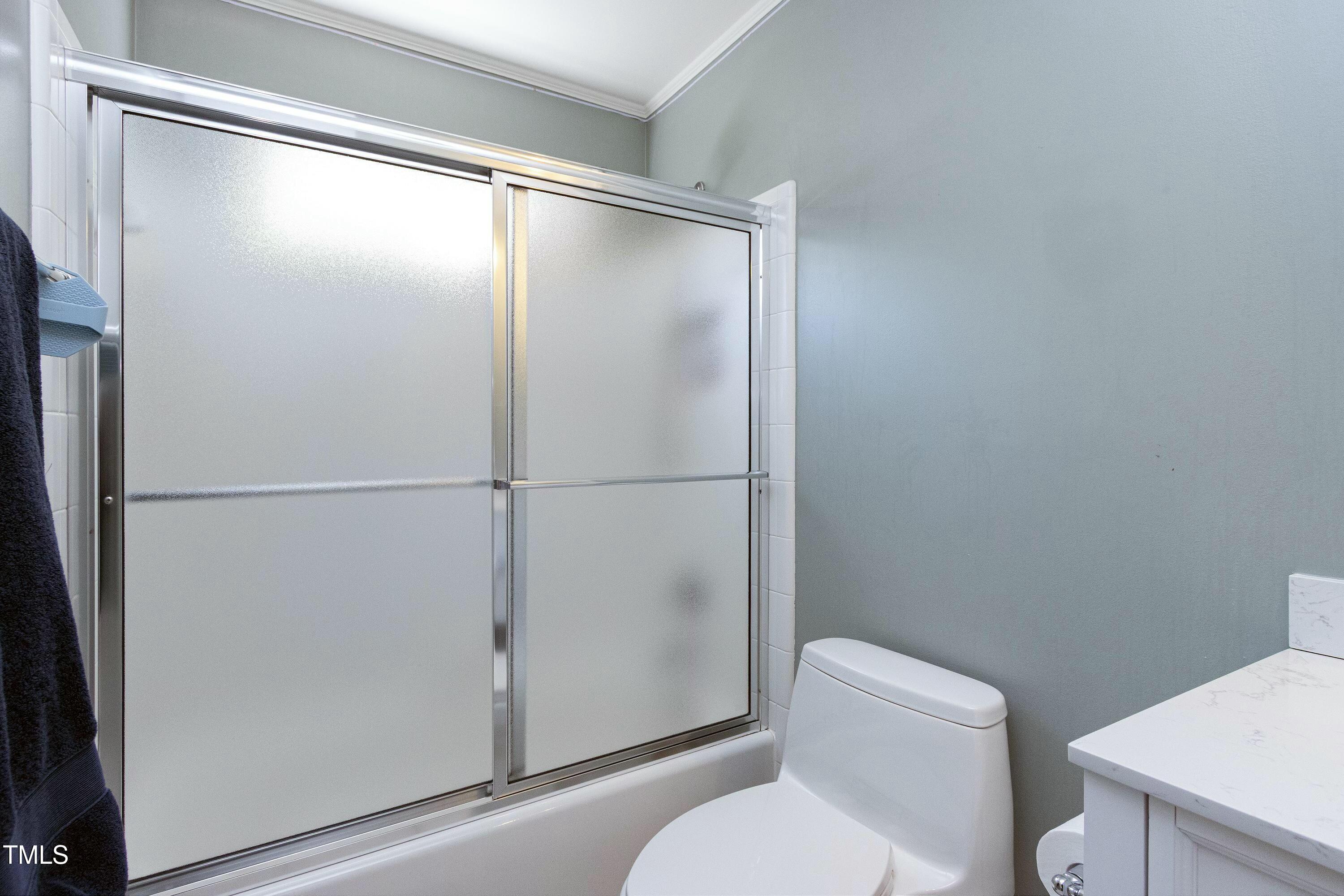 111 Finnway Lane Cary, NC 27519 - Photo 39 of 68 a bathroom with a shower and a toilet