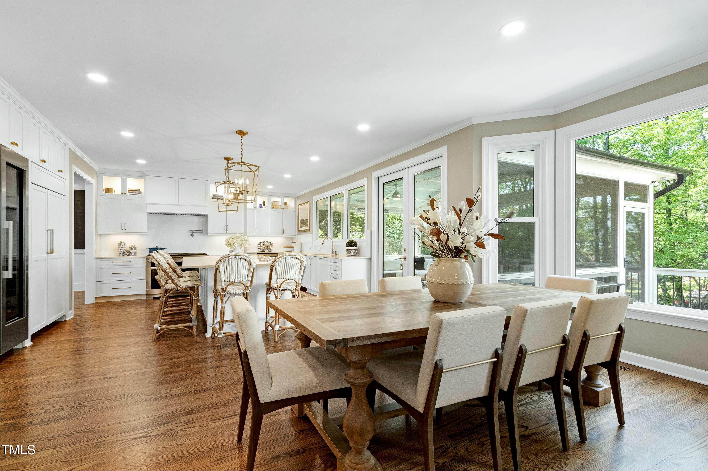 111 Finnway Lane Cary, NC 27519 - Photo 4 of 68 a view of a dining room with furniture window and wooden floor