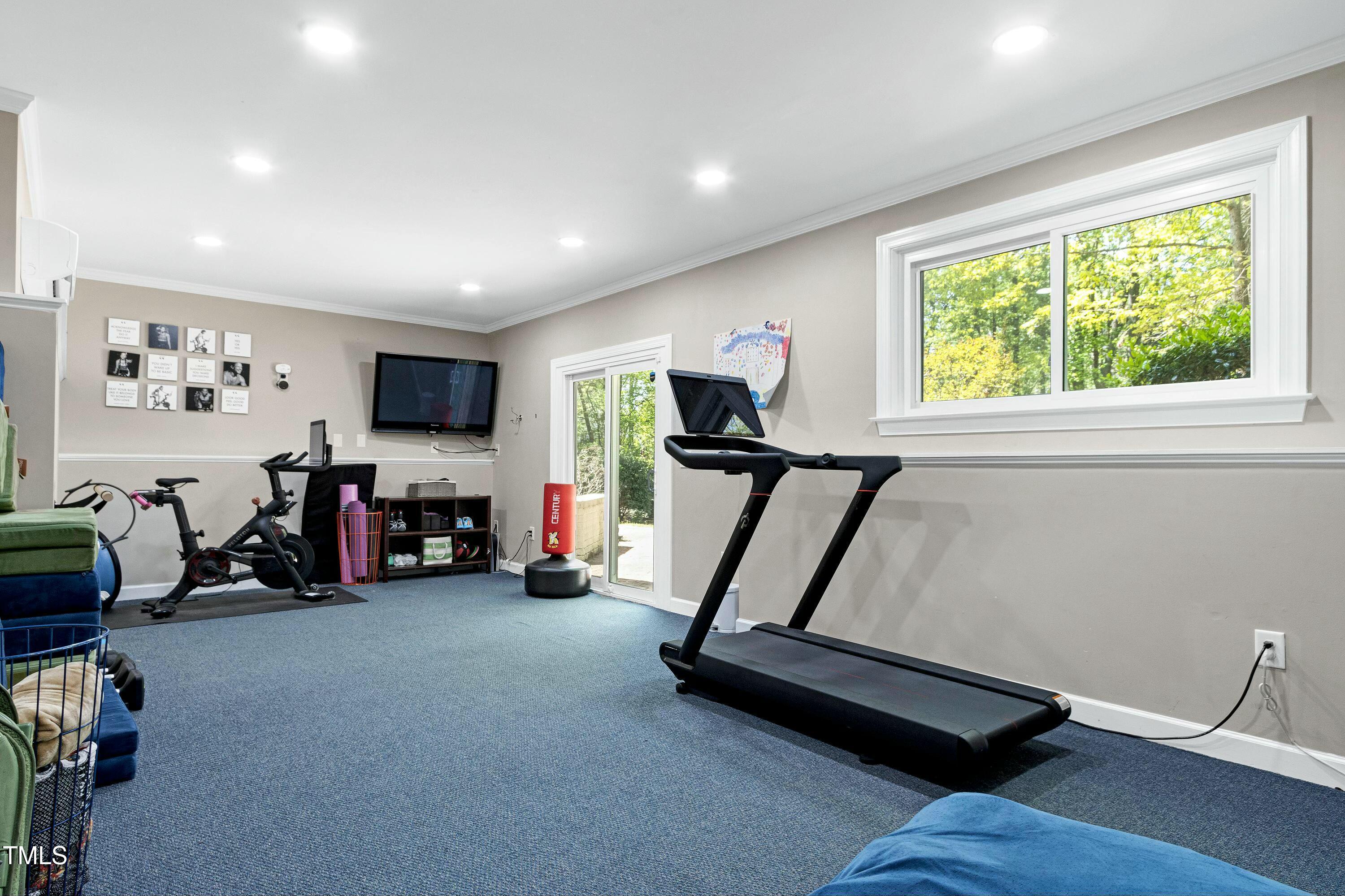 111 Finnway Lane Cary, NC 27519 - Photo 52 of 68 a view of a room with gym equipment