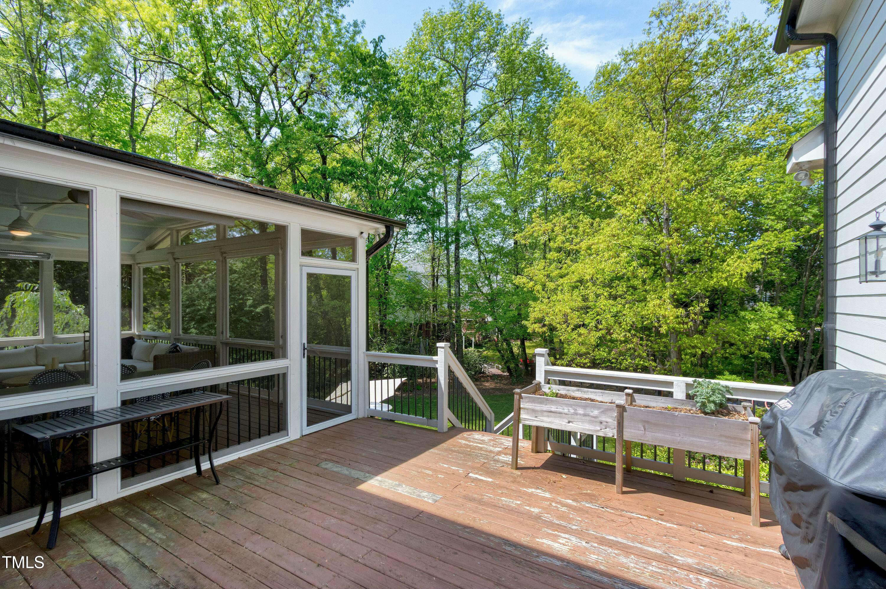 111 Finnway Lane Cary, NC 27519 - Photo 57 of 68 a view of a chairs and table on the wooden deck