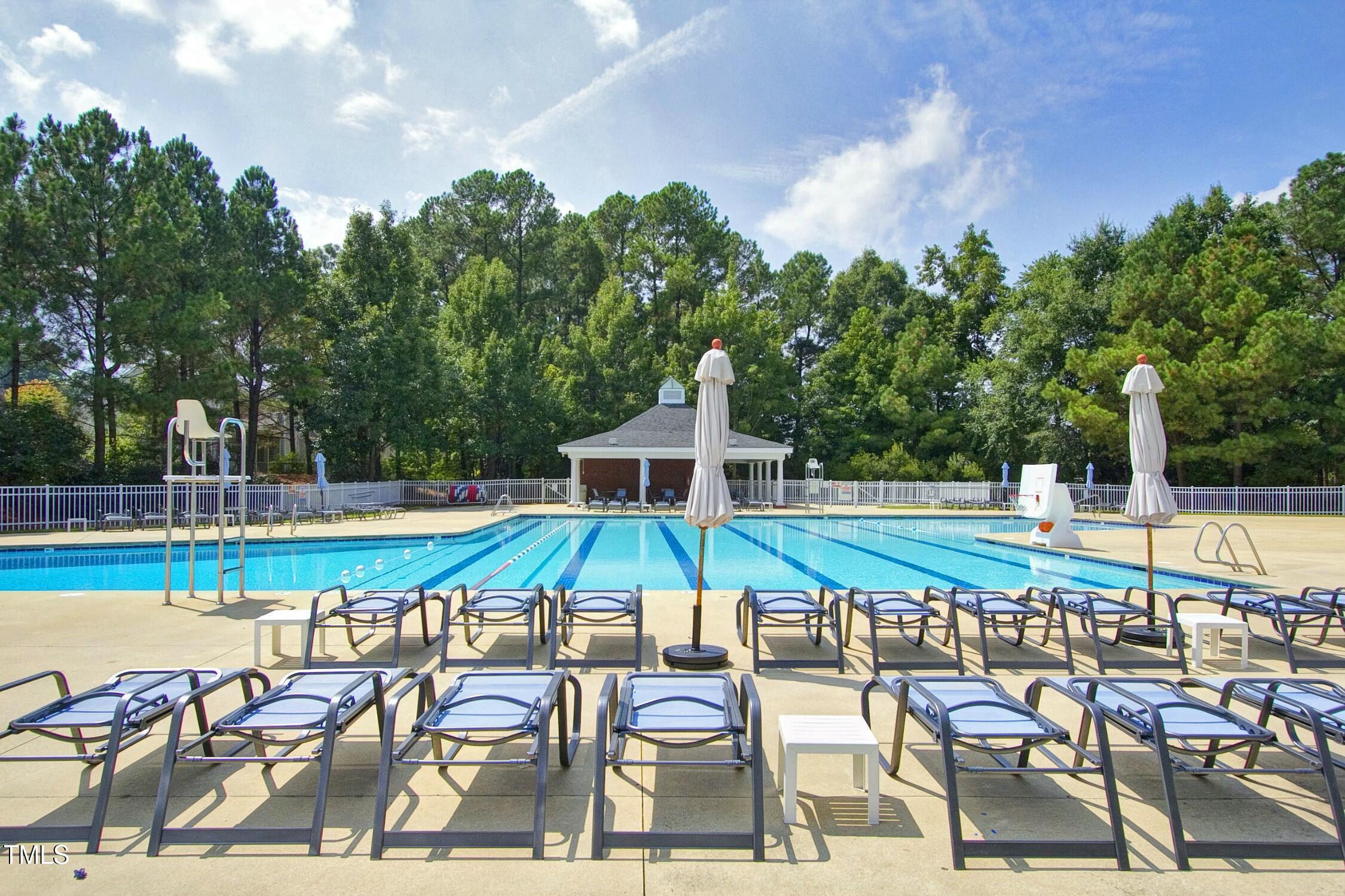 111 Finnway Lane Cary, NC 27519 - Photo 66 of 68 a view of a swimming pool with a patio