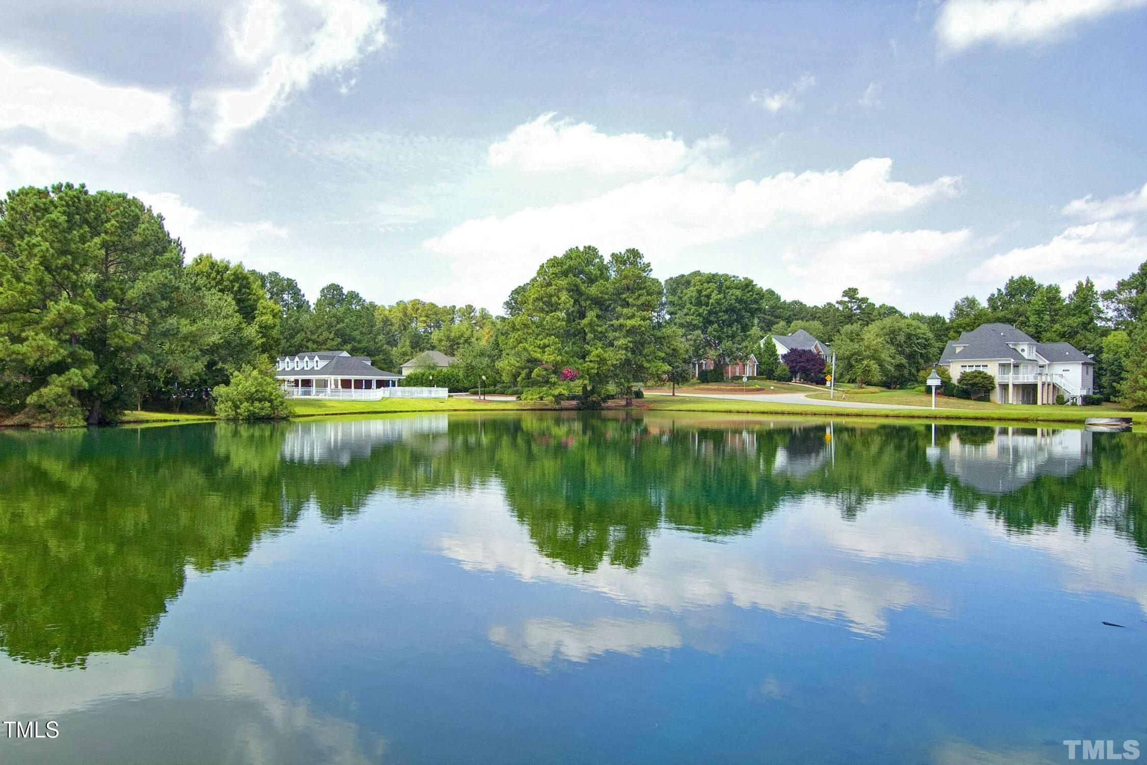 111 Finnway Lane Cary, NC 27519 - Photo 67 of 68 a view of a lake with a house in the background