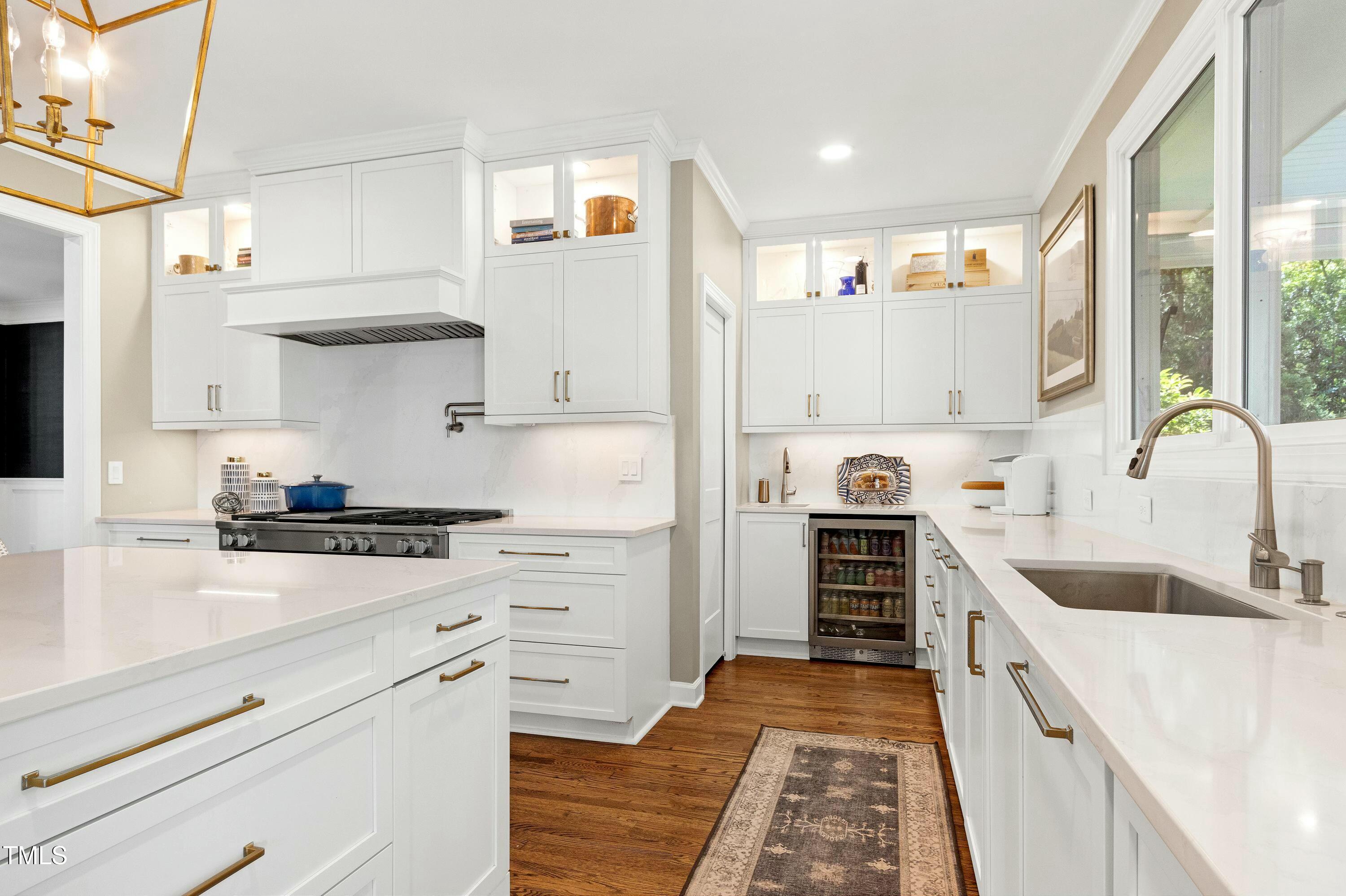 111 Finnway Lane Cary, NC 27519 - Photo 7 of 68 a kitchen with white cabinets and appliances