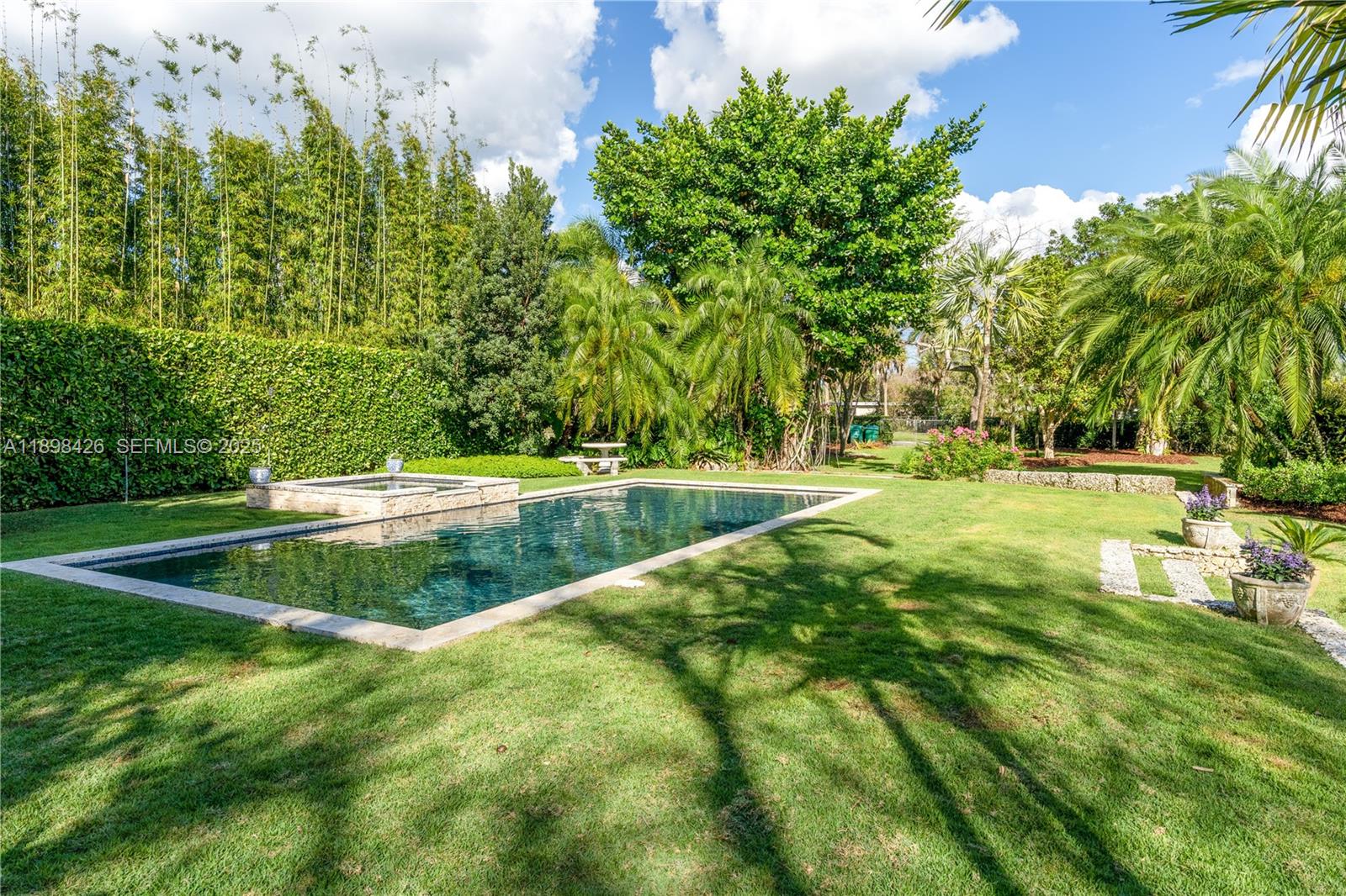 a view of a swimming pool with a yard