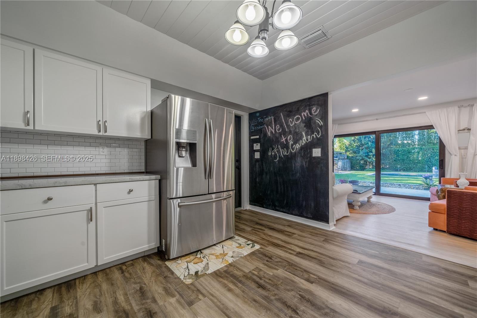29880 Southwest 183rd Court Homestead, FL 33030 - Photo 12 of 36 a kitchen with stainless steel appliances granite countertop a refrigerator stove and cabinets