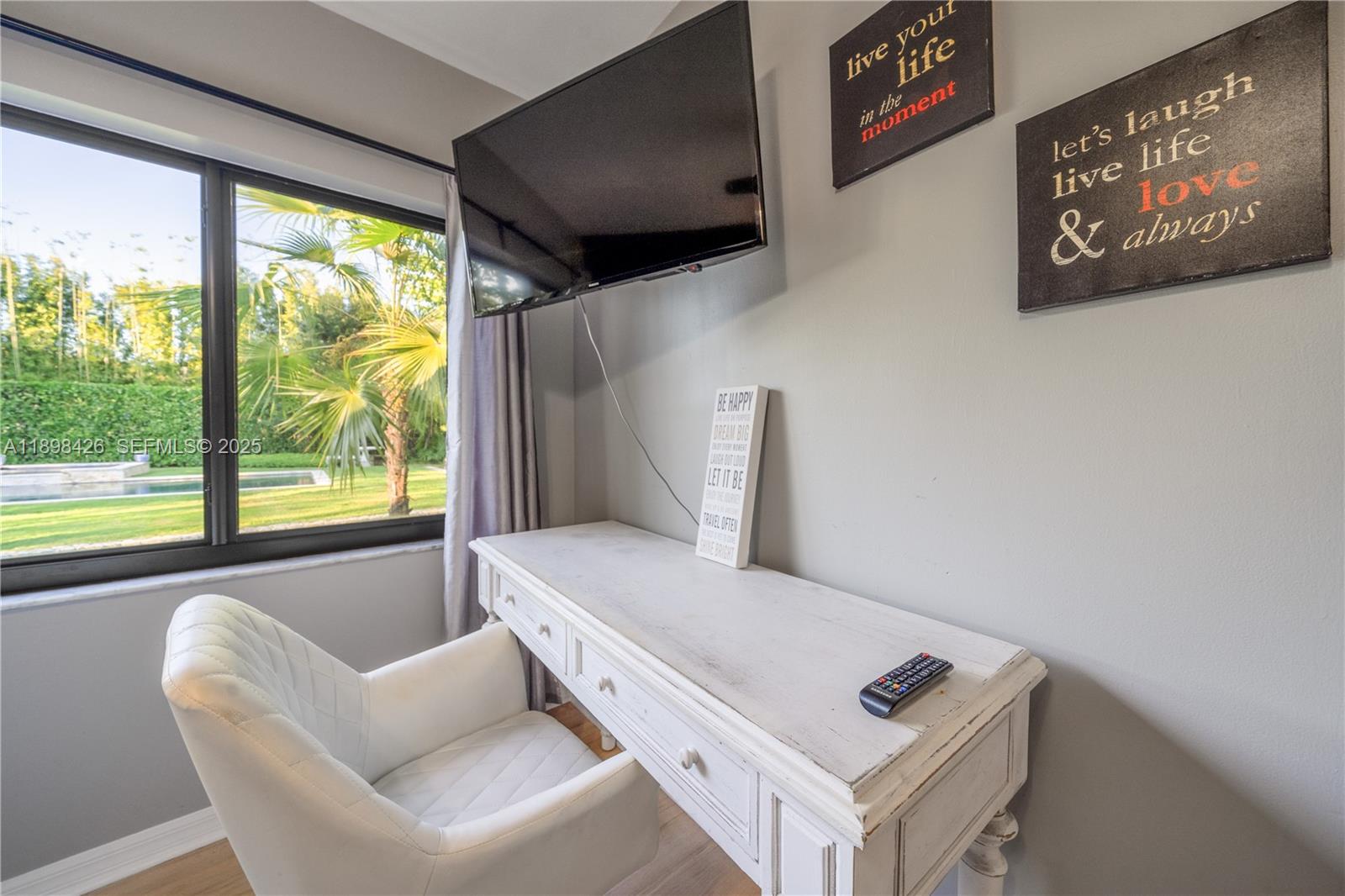 29880 Southwest 183rd Court Homestead, FL 33030 - Photo 16 of 36 a living room with furniture and a window