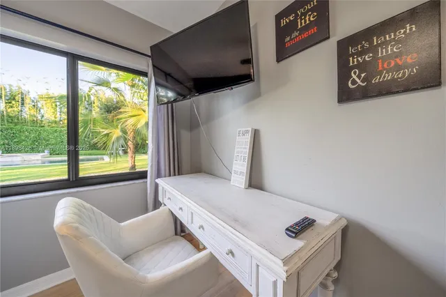 a living room with furniture and a window