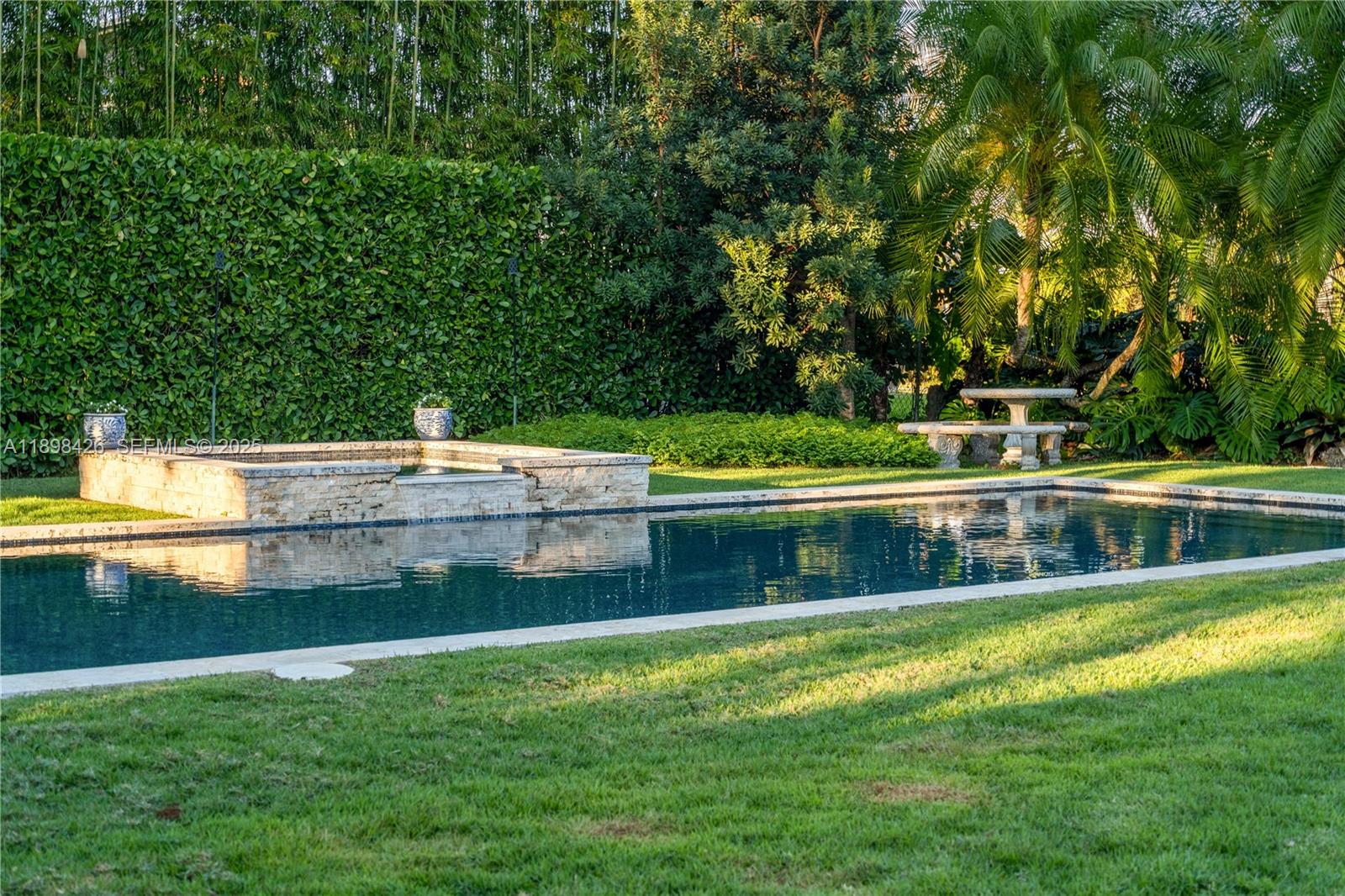 29880 Southwest 183rd Court Homestead, FL 33030 - Photo 31 of 36 a view of a house with a swimming pool