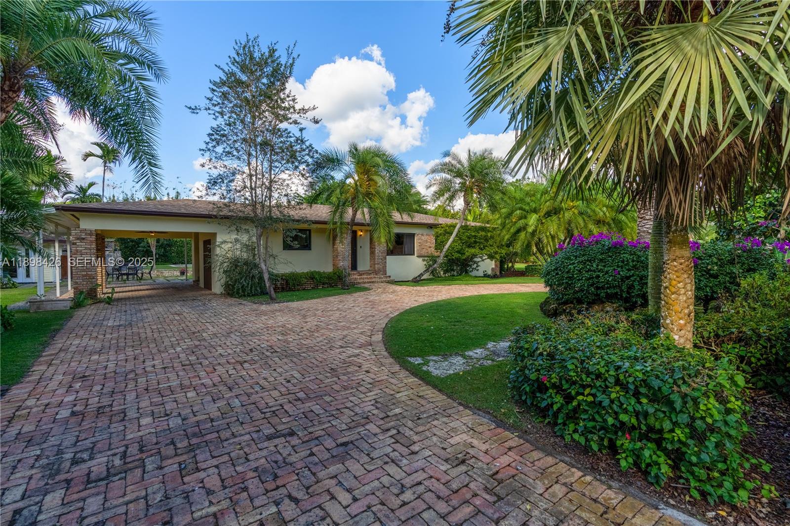 29880 Southwest 183rd Court Homestead, FL 33030 - Photo 33 of 36 a front view of a house with a garden