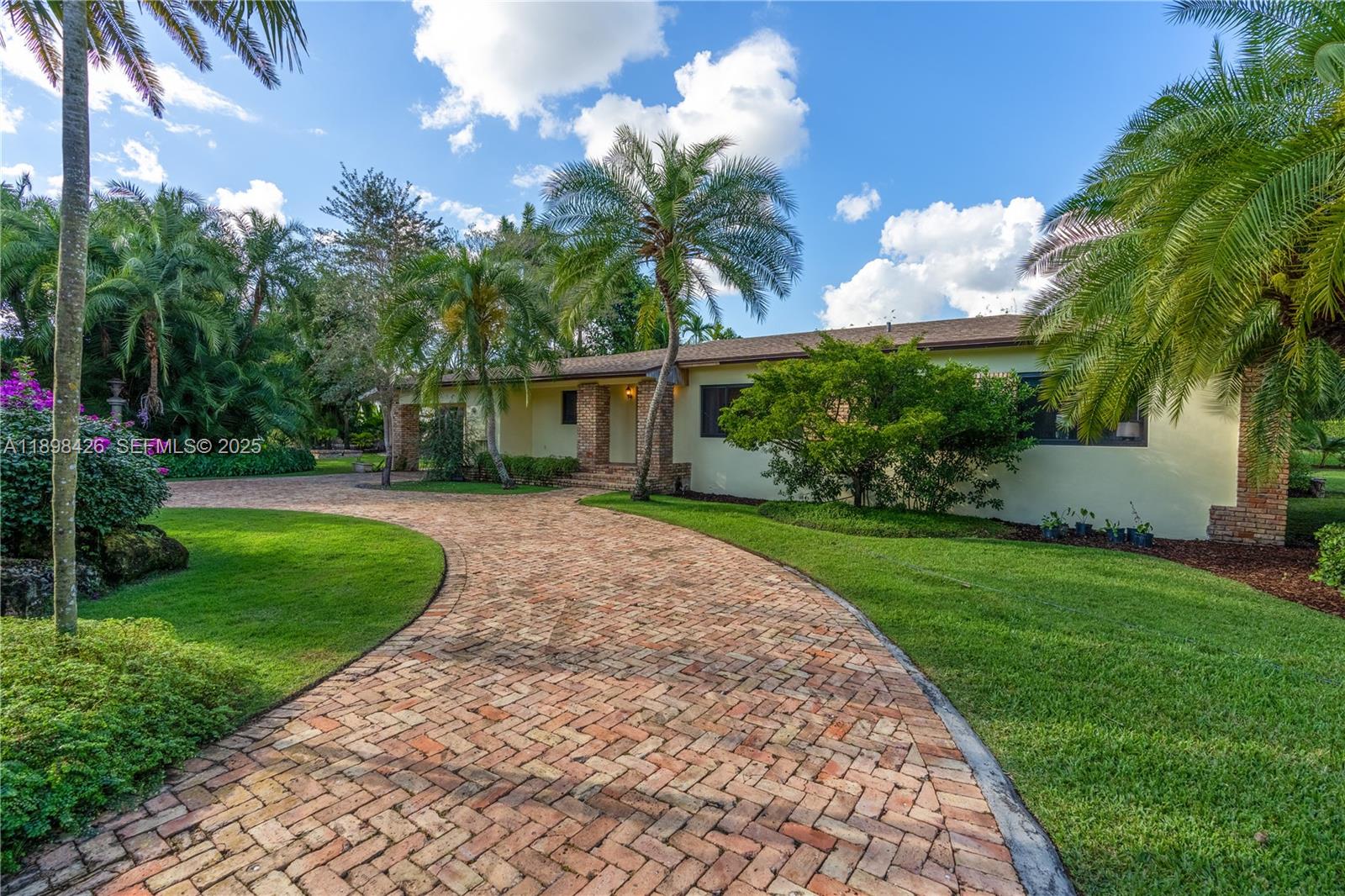 29880 Southwest 183rd Court Homestead, FL 33030 - Photo 34 of 36 a view of a house with a yard