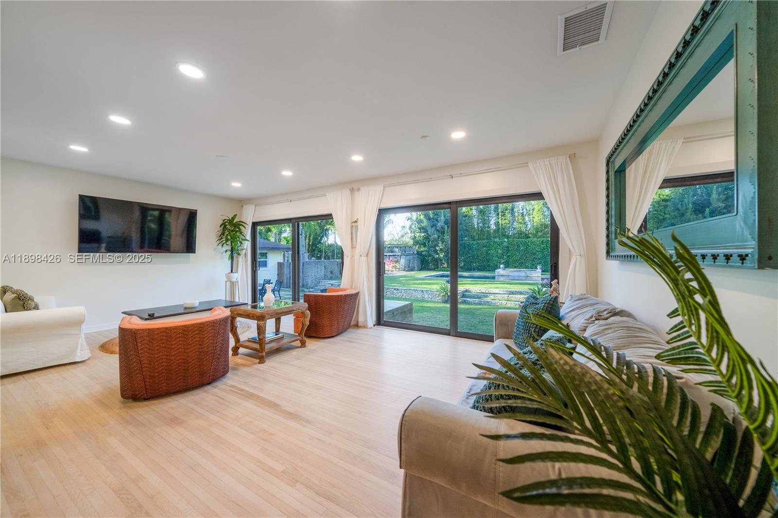 29880 Southwest 183rd Court Homestead, FL 33030 - Photo 4 of 36 a living room with furniture large window with outer view