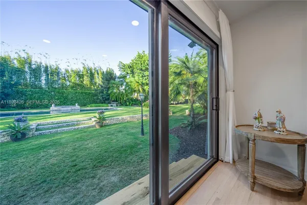 a view of backyard with tub and trees