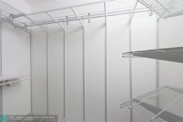 a view of a room with racks on the wall