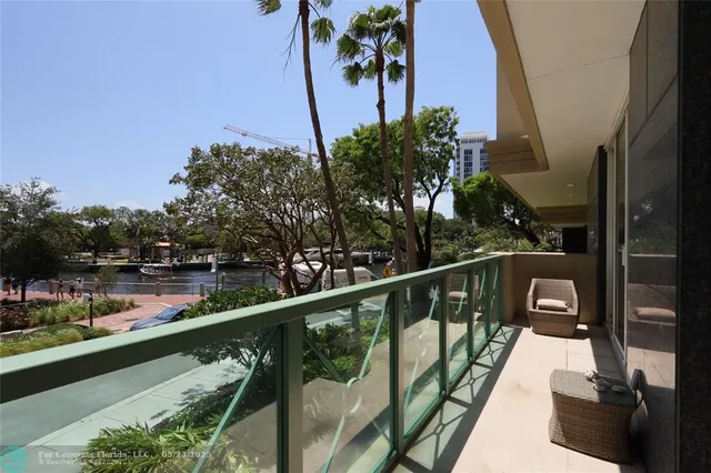 a view of a balcony with wooden floor