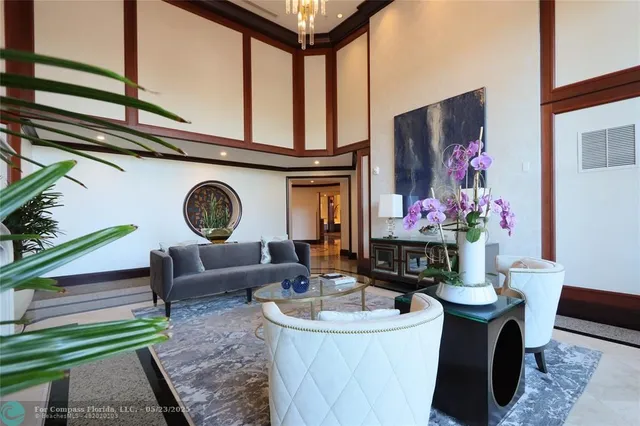 a living room with furniture a rug and a fireplace