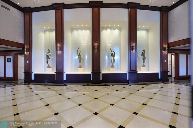 a very nice looking room with a large window and furniture