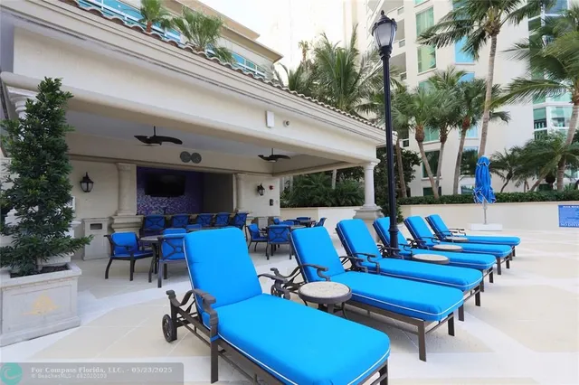 a view of a chairs and table in patio