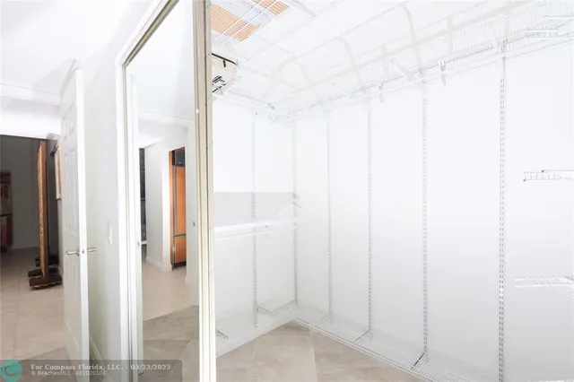 a bathroom with a shower and a glass door