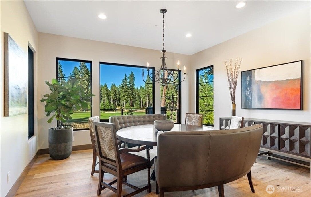 47 Frst Rdg Drive Cle Elum, WA 98922 - Photo 23 of 40 a dining room with furniture a chandelier and wooden floor