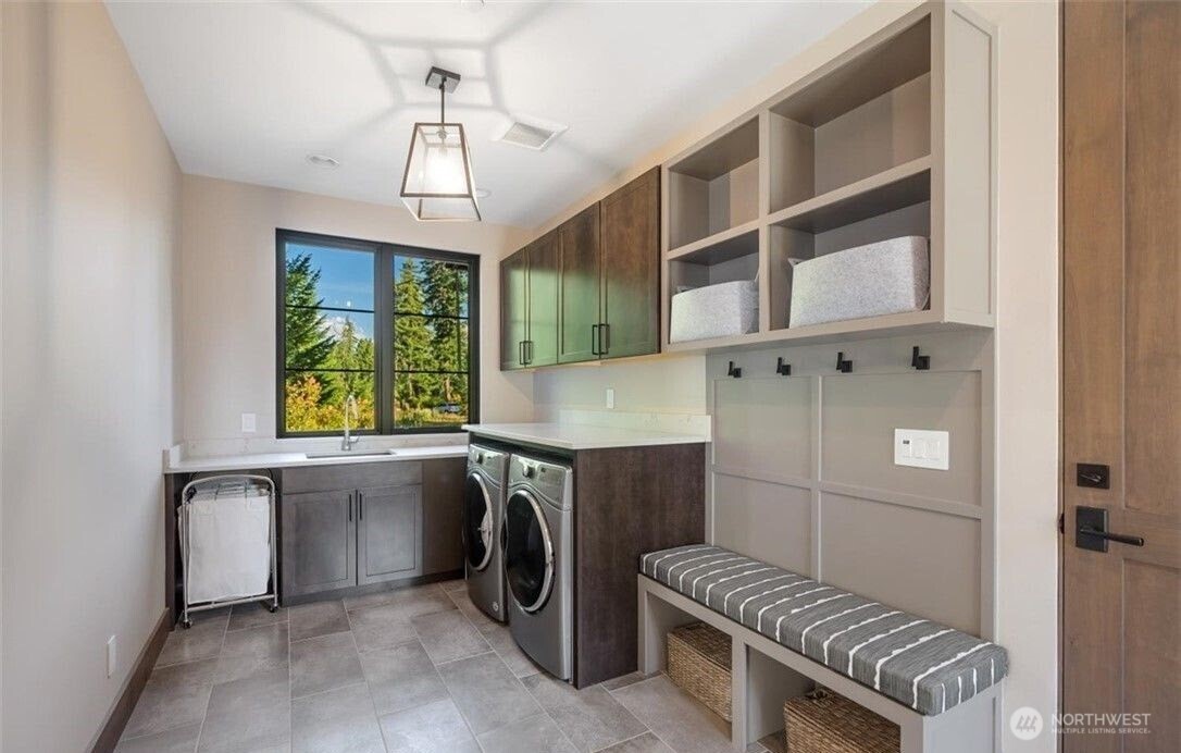 47 Frst Rdg Drive Cle Elum, WA 98922 - Photo 32 of 40 a utility room with cabinets dryer and washer