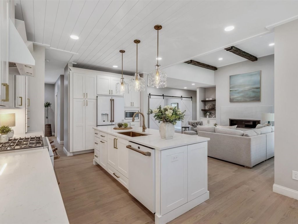 9 West Way Mashpee, MA 02649 - Photo 16 of 42 a large white kitchen with kitchen island a white cabinets and refrigerator