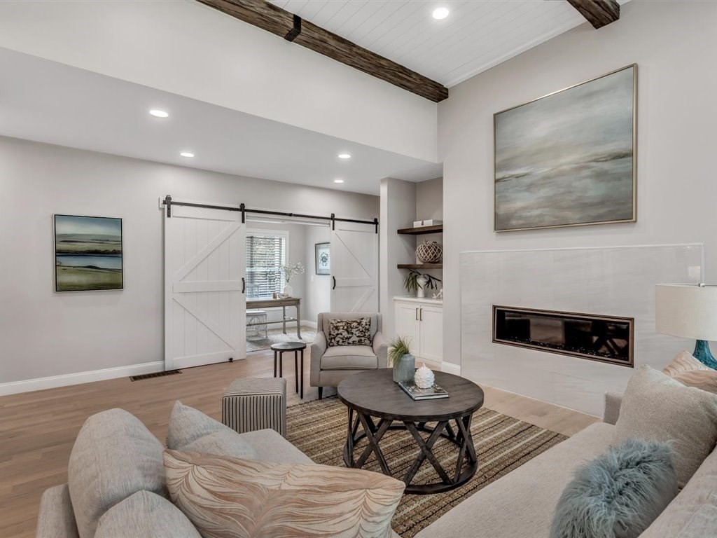 9 West Way Mashpee, MA 02649 - Photo 28 of 42 a living room with furniture and a fireplace