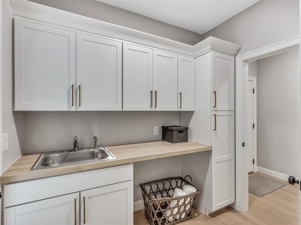 9 West Way Mashpee, MA 02649 - Photo 36 of 42 a kitchen with a sink cabinets and utility